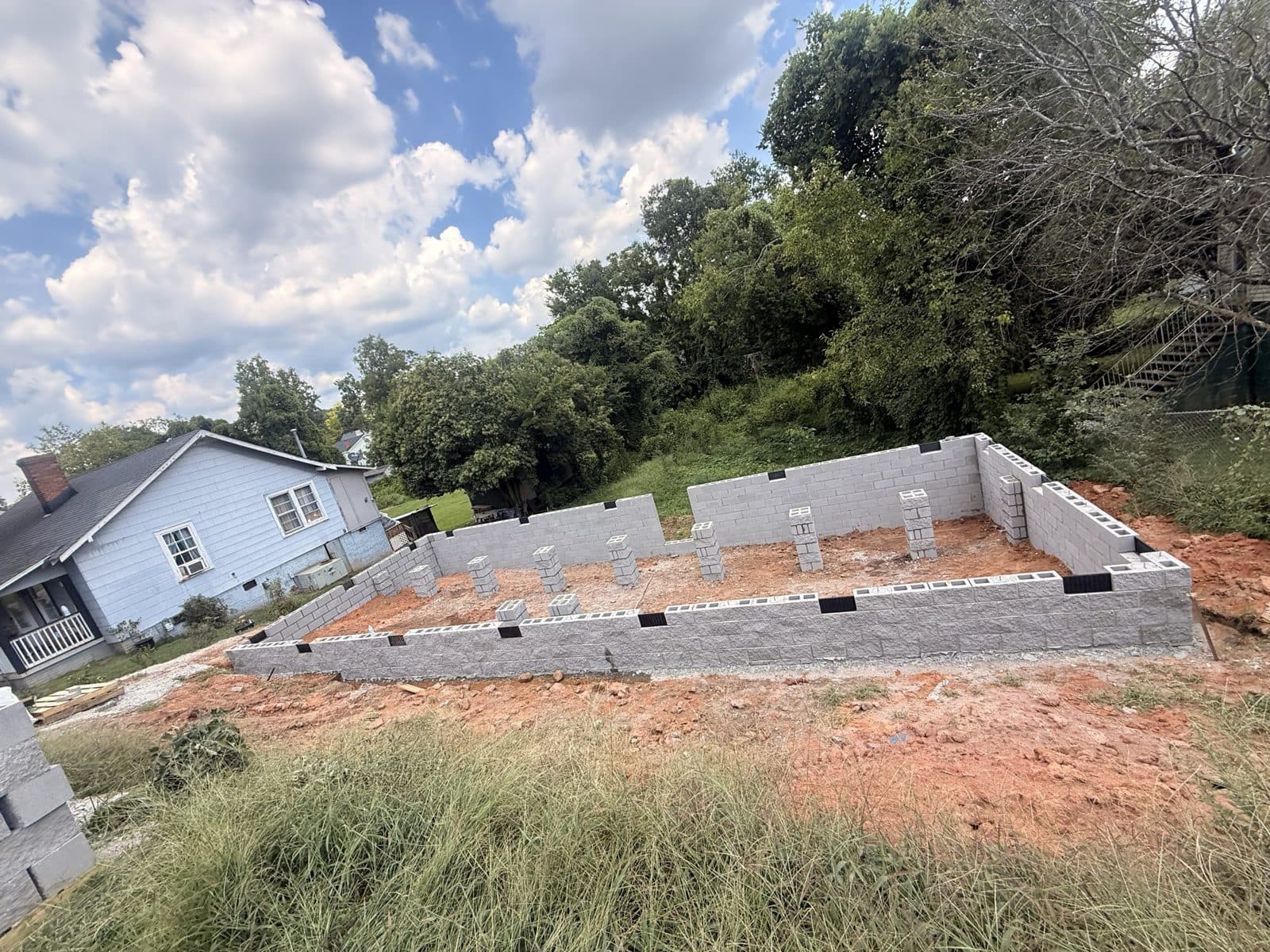 August 2026 — block foundation on the infill lot